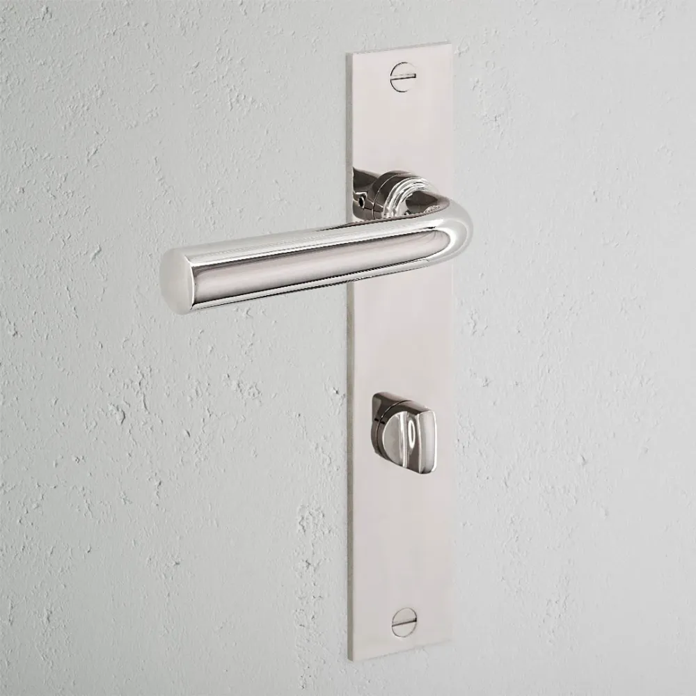 Manilla para puertas Apsley con placa larga (con muelle) y sistema giratorio - Níquel pulido