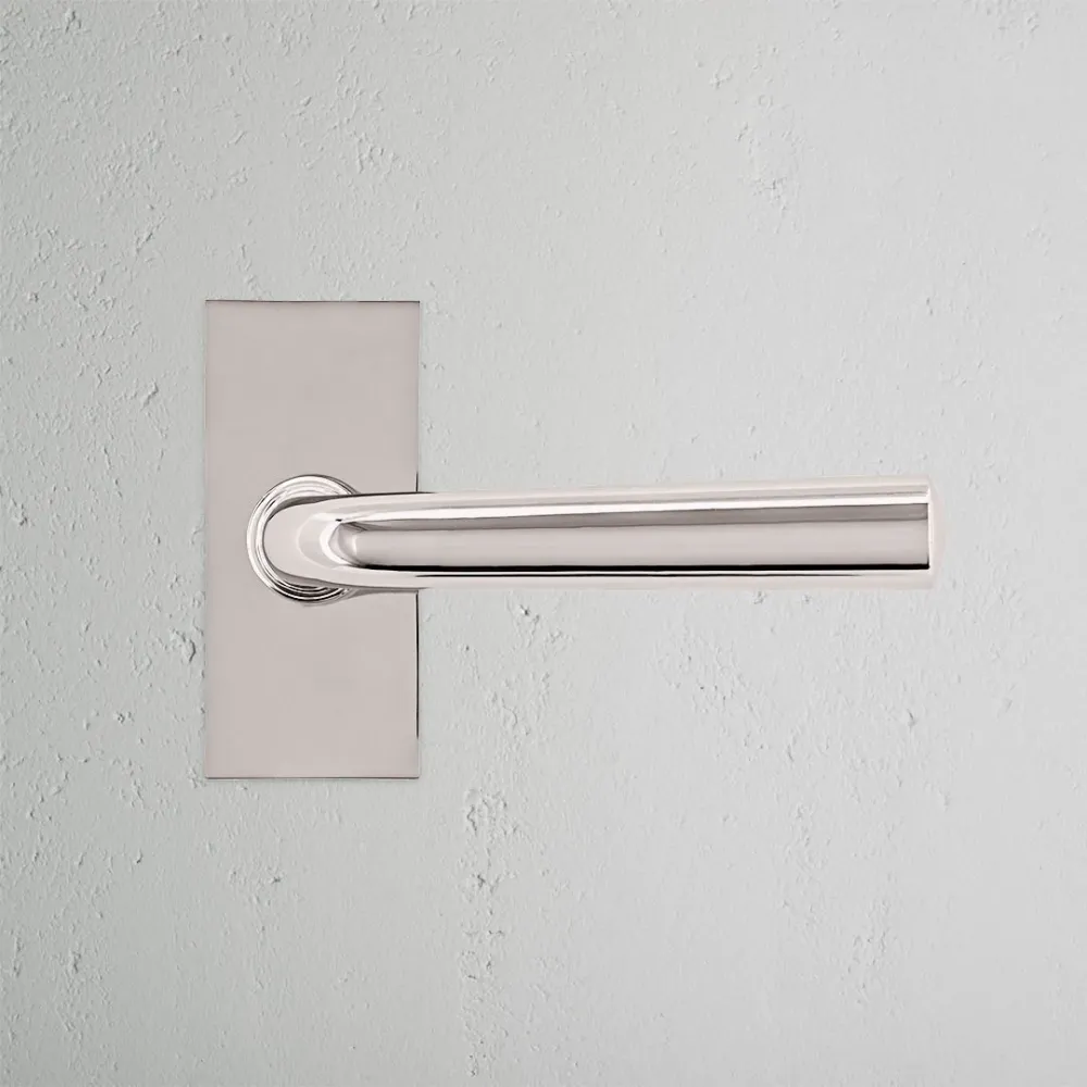 Manilla para puertas Apsley con placa corta (fija) - Níquel pulido