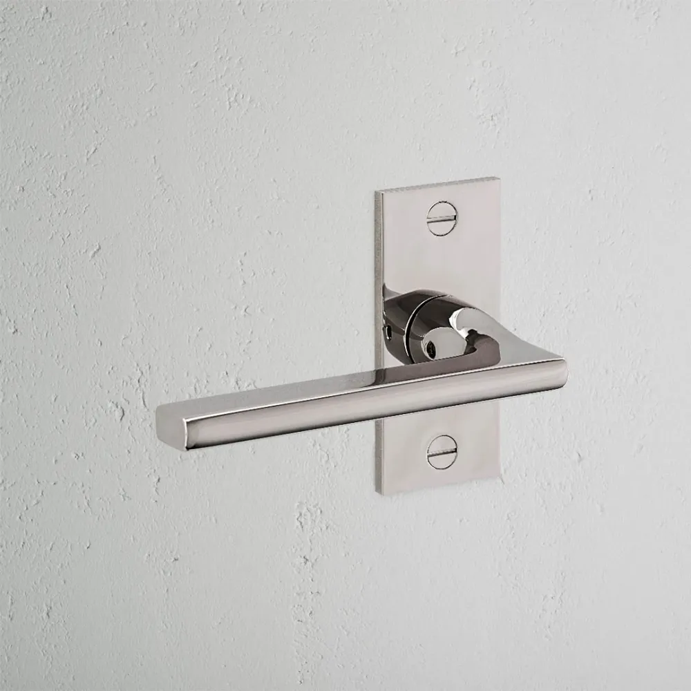 Manilla para puertas Clayton con placa corta (fija) - Níquel pulido