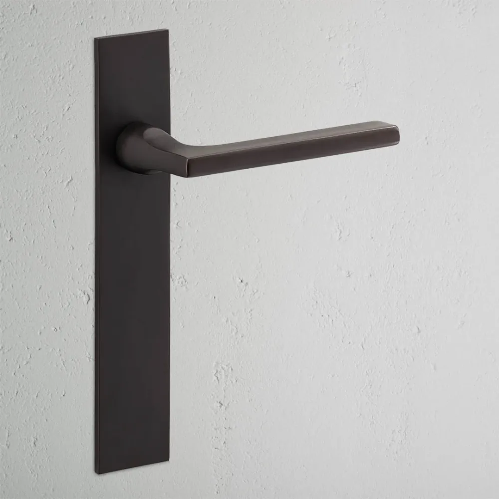 Manilla para puertas Clayton con placa larga (sin muelle) - Bronce