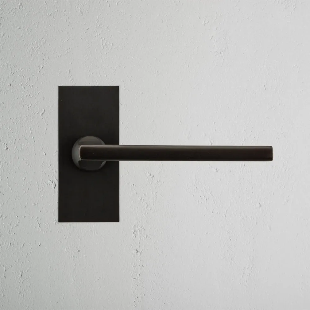 Manilla para puertas Clayton con placa corta (sin muelle) - Bronce