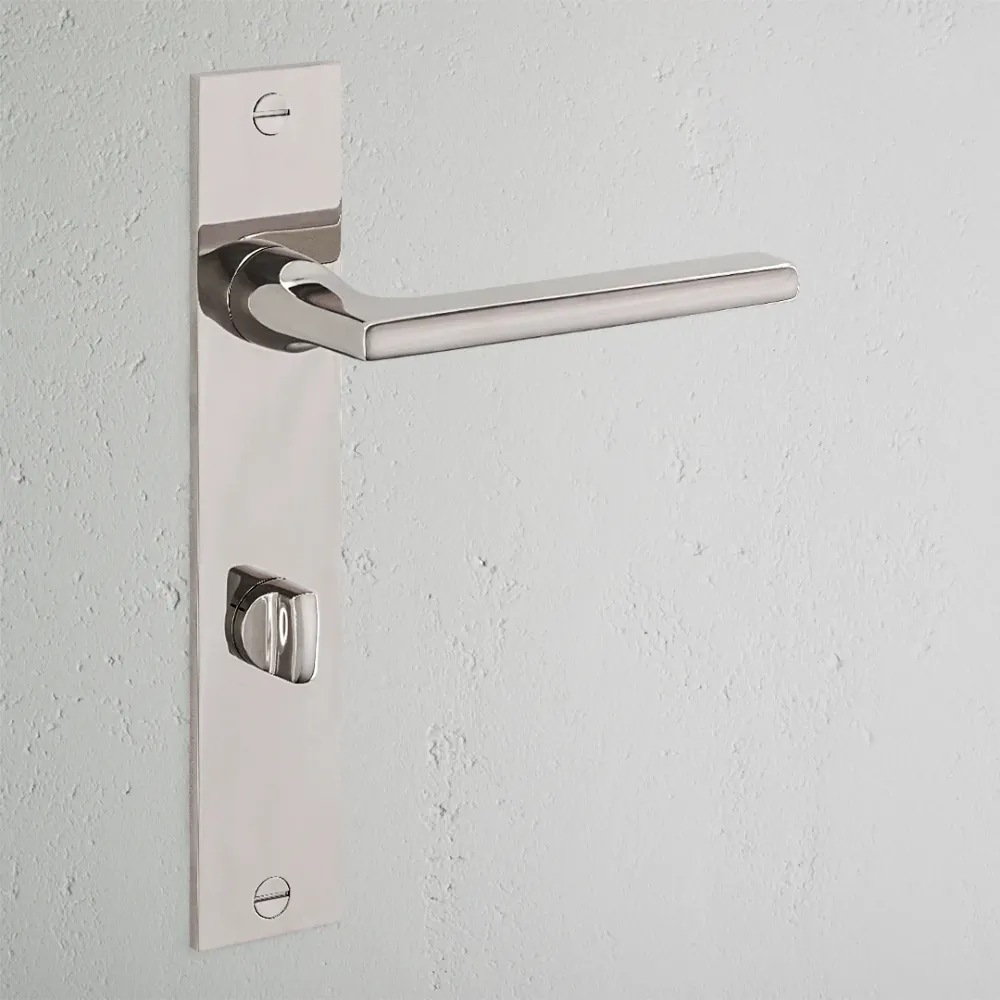 Manilla para puertas Clayton con placa larga (con muelle) y sistema giratorio - Níquel pulido