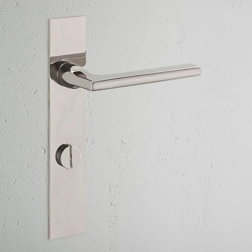 Manilla para puertas Clayton con placa larga (con muelle) y sistema giratorio - Níquel pulido
