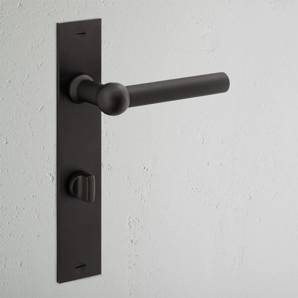 Manilla para puertas Harper con placa larga (con muelle) y condena - Bronce