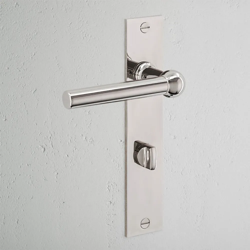 Manilla para puertas Harper con placa larga (con muelle) y sistema giratorio - Níquel pulido