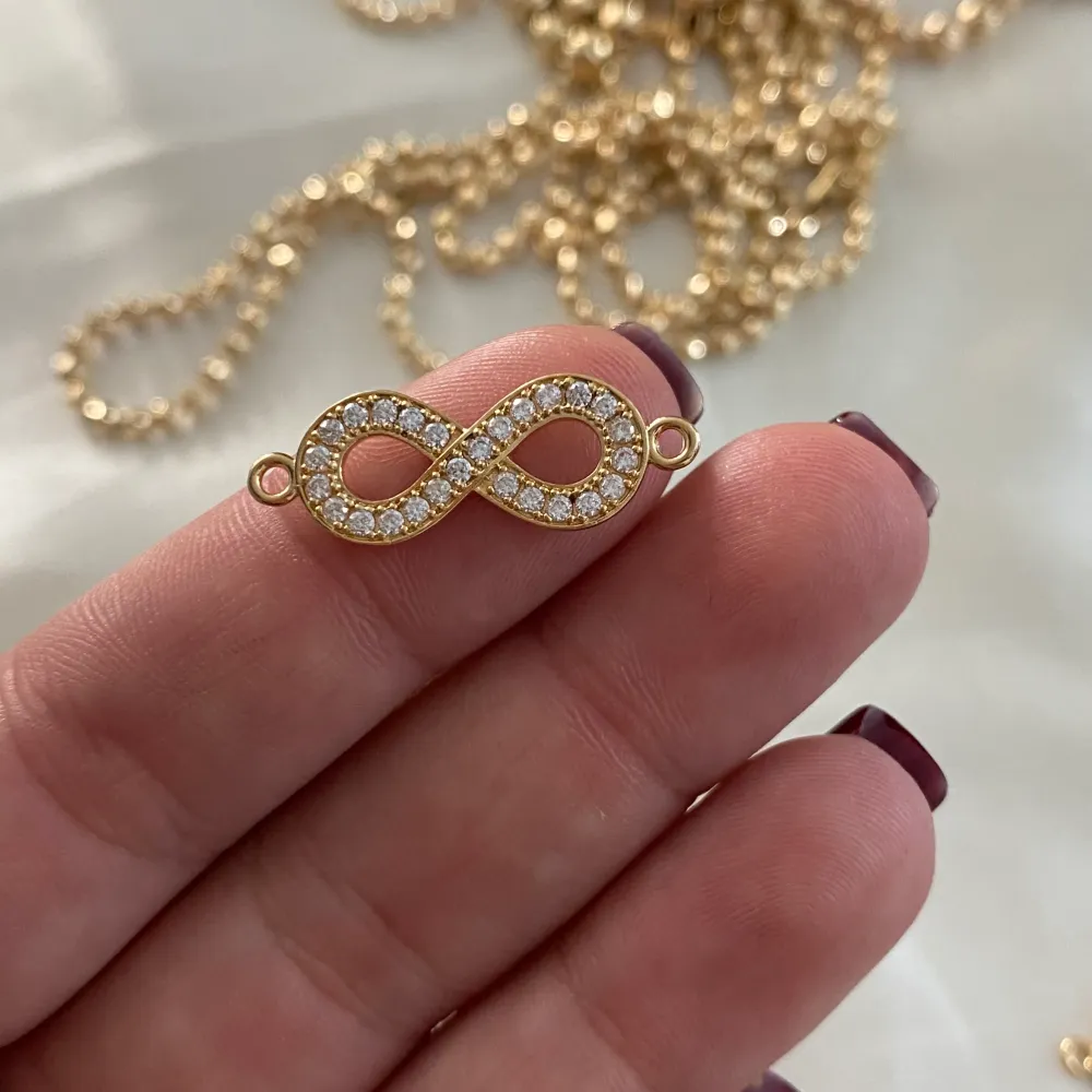 Herraje Infinito 1.5gr/2.5cm Oro Amarillo Circones Blancos Medellin
