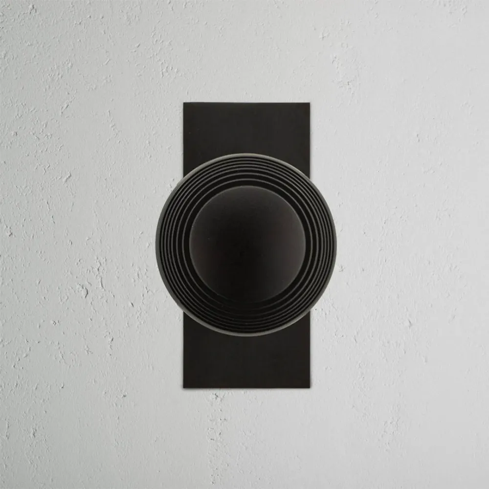 Pomo para puertas Poplar con placa corta (fijo) - Bronce